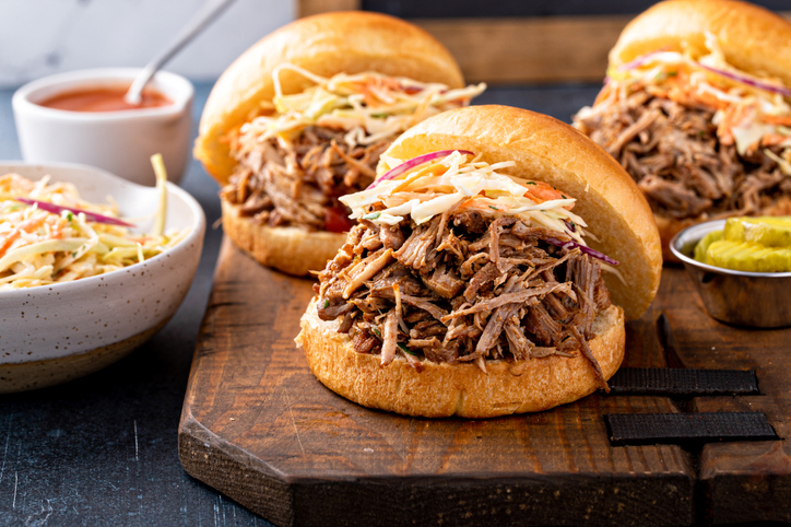 Pulled pork sandwiches on a platter ready to be paired with Bordeaux wines