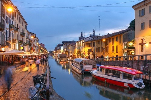 Enjoying a relaxing evening along the Naviglio Grande canal in Milan, Italy.