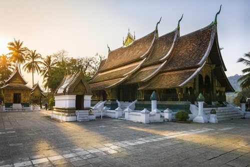 Observe Buddha’s hands at popular temples Wat Xieng Thong and Wat Wisunarat