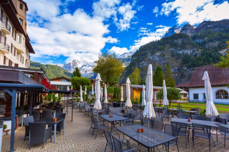 Kandersteg Swiss Mountain Village view from cafe with mountains in the background