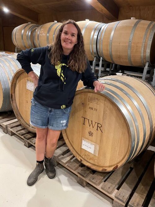Anna Flowerday, Winegrower in the barrel room at Te Whare Ra, Marlborough