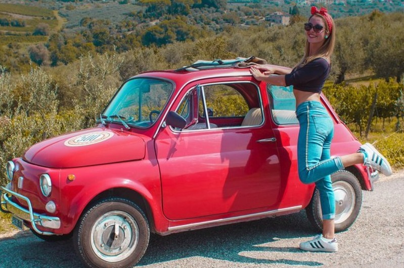 Fiat tuscany wine tour with girl posing