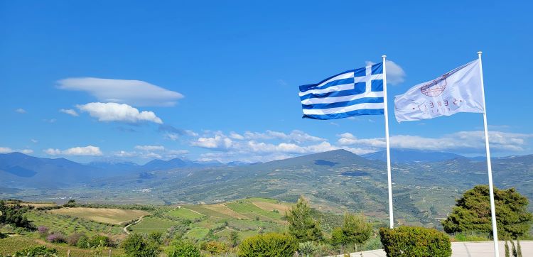 Greek flag waves over Nemea Valley from Semeli Estate
