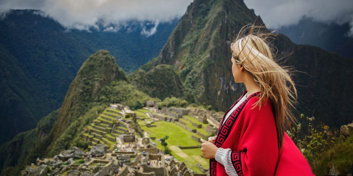Best things to do in Peru, woman looking out over Machu Picchu