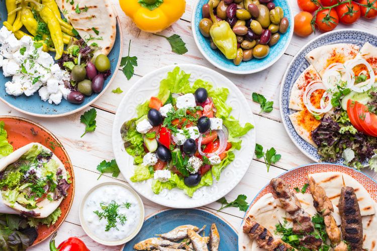 Overhead view of a table with typical Mediterranean diet foods and dishes