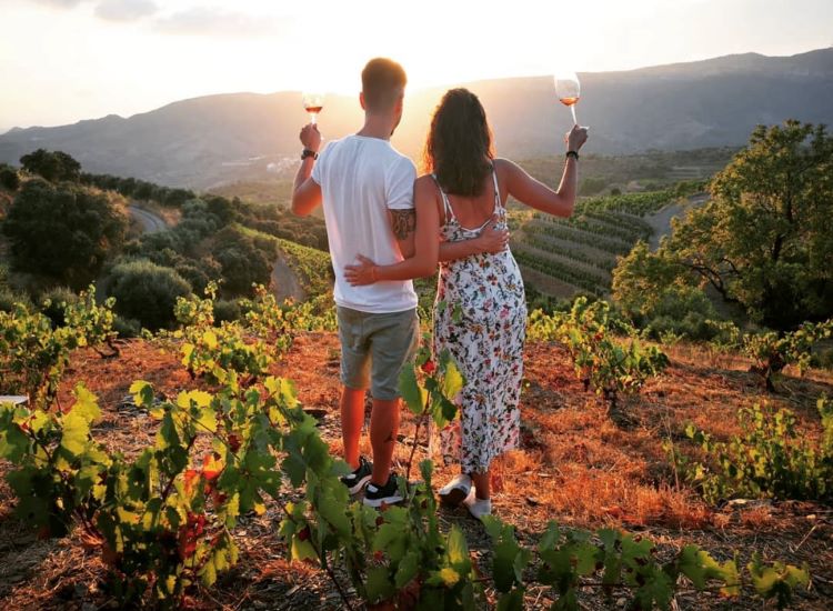 couple enjoying a wine tour in Catalonia during sunset with wine tasting