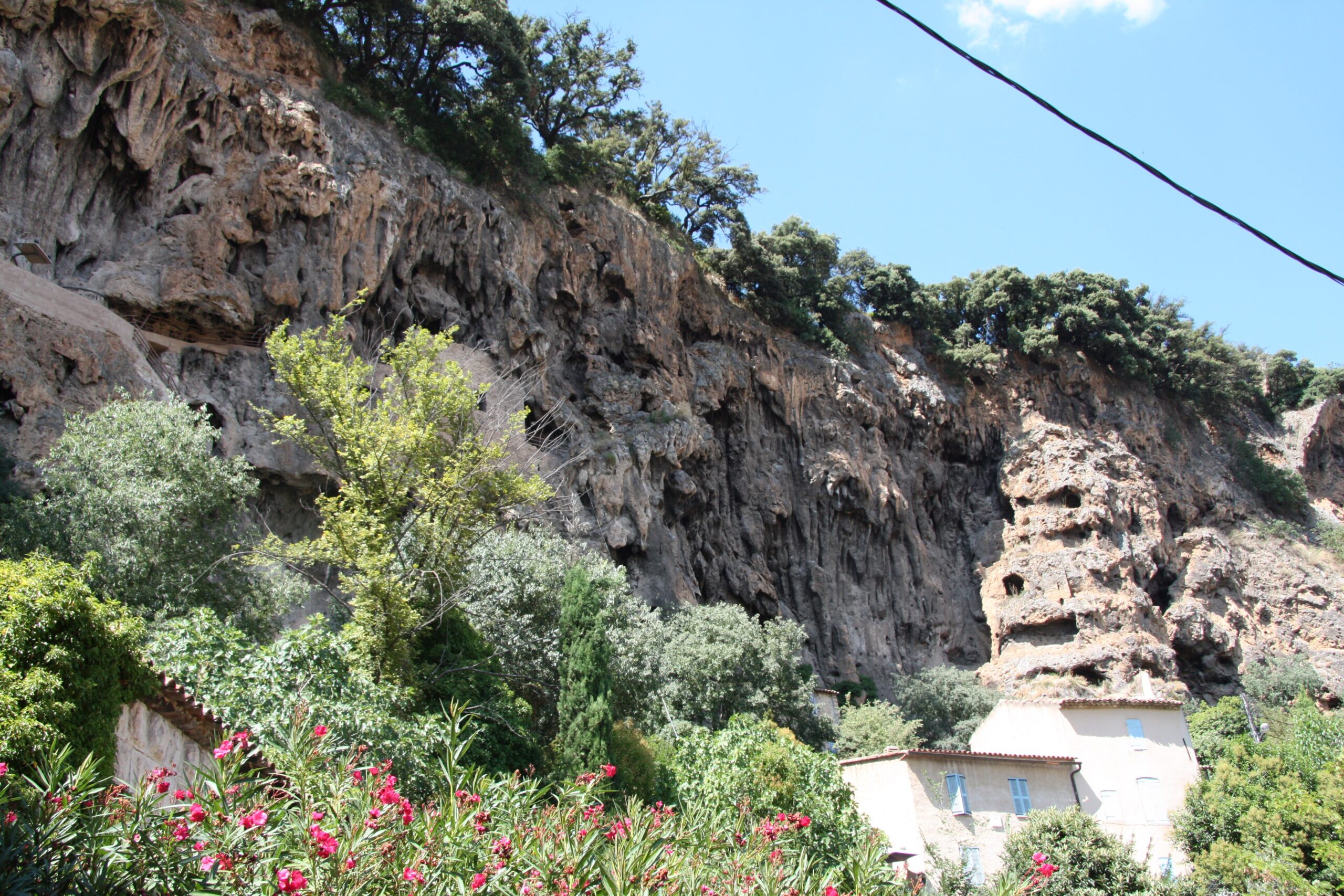 The tuff cliff and troglodyte caves above the village of Cotignac