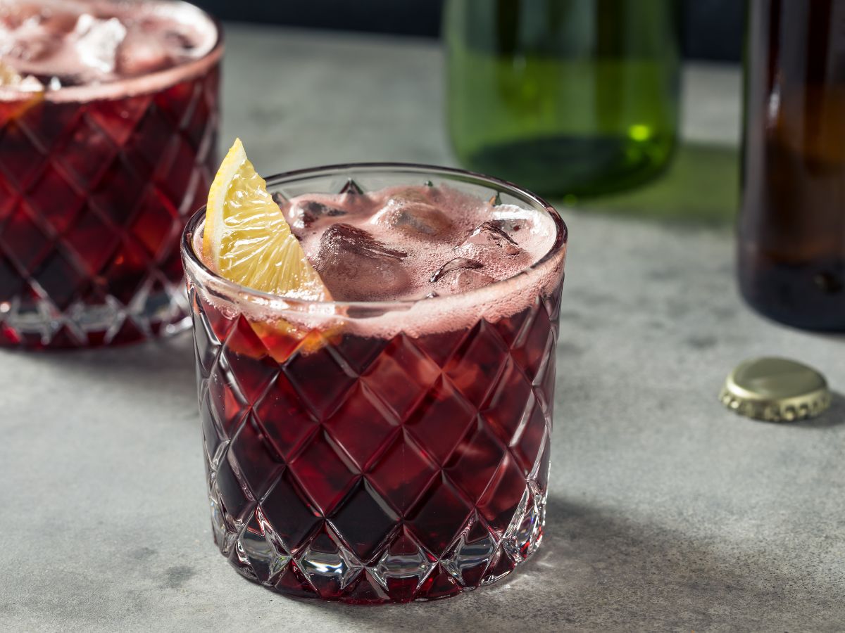 Kalimotxo, red wine and cola over ice with a lemon wedge