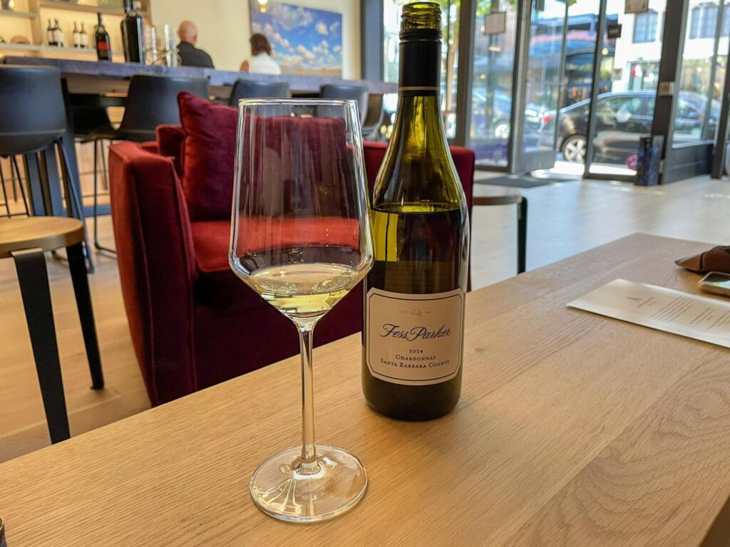 A glass of Ashley's Chardonnay at the Fess Parker tasting room in Napa